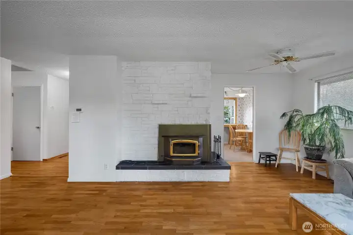 Anchor your main living space around this statement fireplace and cozy woodstove insert.