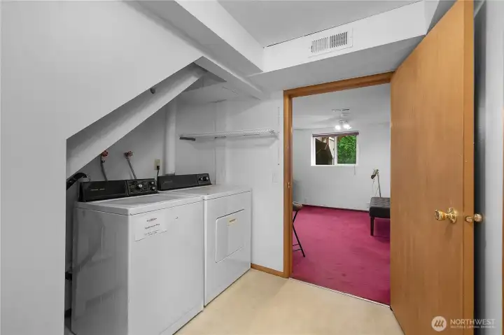 Laundry - Appliances included - Dedicated laundry area with side-by-side washer and dryer setup.