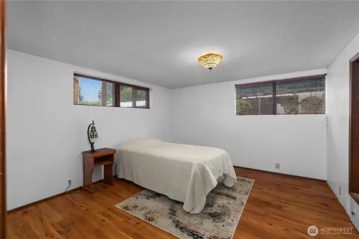 BR 4 - Settle into this comfortable lower-level bedroom with extra privacy and space.