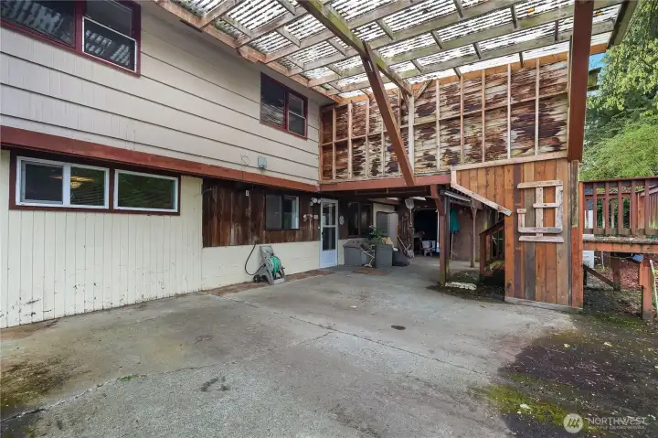 Attached Carport/patio area - Enjoy covered outdoor living and flexible space.