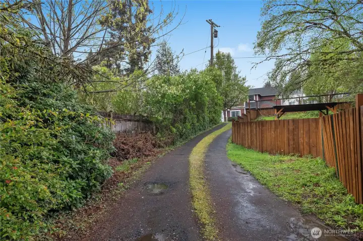 Arrive with ease via the long driveway leading to generous parking and yard space.