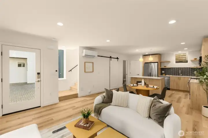 Kitchen opens to living and dining areas.