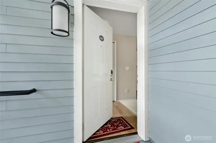 Private entry with covered front door and welcoming foyer.