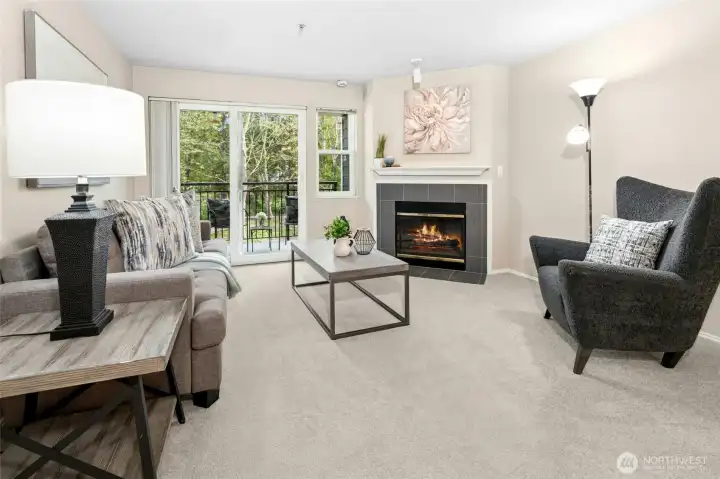 Bright living room with fireplace and natural light.