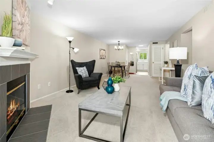 Spacious living area with open layout and fireplace feature.