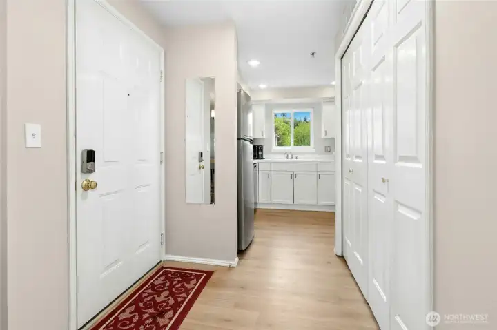 Entry hallway with storage and access to main living areas.