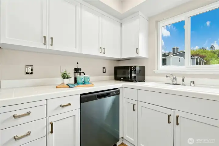 Kitchen with window for natural light and functional layout.