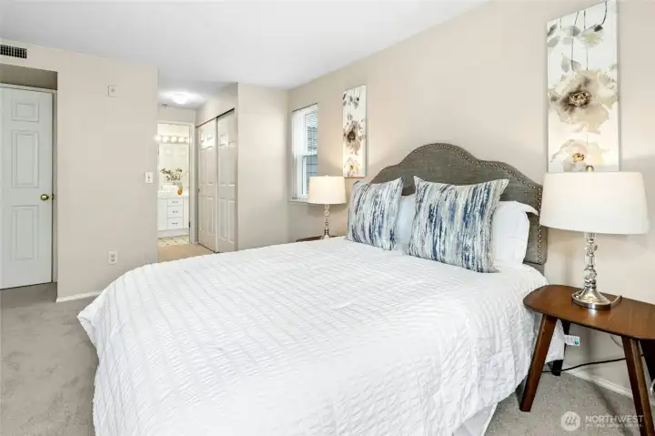 Alternate view of primary bedroom with en suite access.