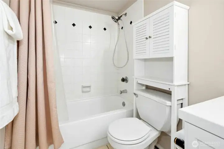 Full bathroom with tub/shower combination.