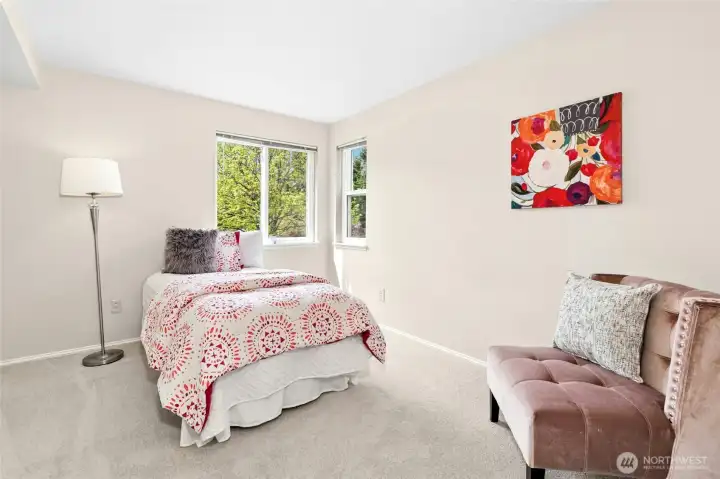 Bedroom with natural light, ideal for guest or office.