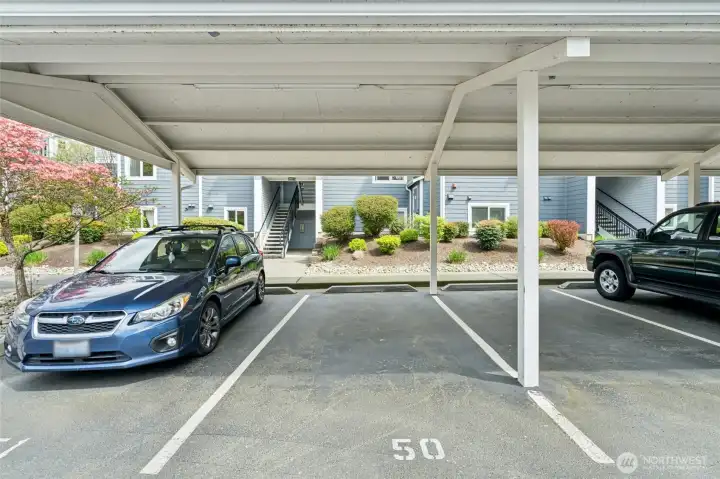 Assigned covered parking space with additional guest parking available.