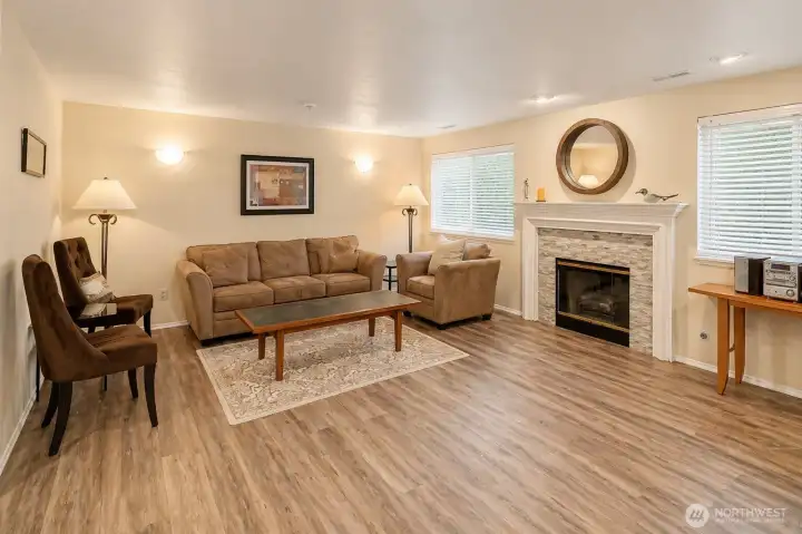 Clubhouse interior with seating area and fireplace.