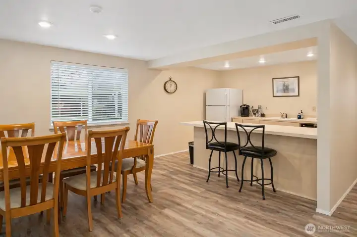 Clubhouse kitchen and dining area for gatherings and events.