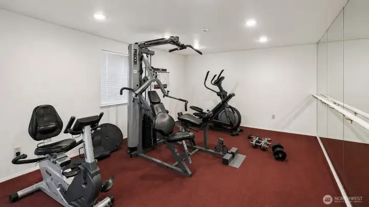 Fitness room with exercise equipment.
