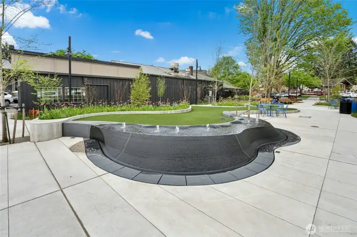 Public plaza area with seating and open gathering space.