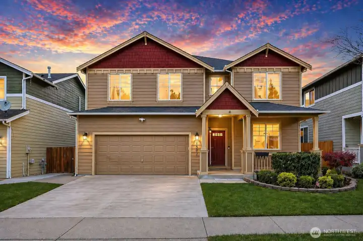 Prepare to be captivated! This stunning two-story home in the heart of Lacey’s prestigious Freestone Station community is pure curb appeal perfection. With its bold red roof accents, warm tan siding, and elegant covered front porch, this residence commands attention and welcomes you home in grand style, offering both quality and convenience, all at a very attractive price of $615,000.