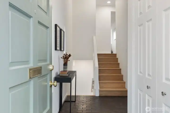 Beautiful brick foyer with coat closet