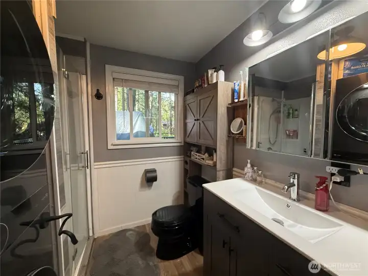 Updated bathroom with washer and dryer.