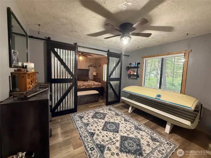 Primary bedroom can be closed off w/ barn door or opened for extra large living space.
