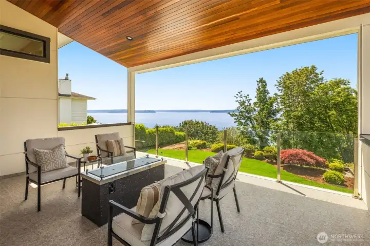 Oversized covered view deck with plumbed gas line to fire table.