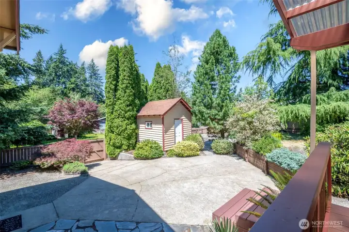 Everyone needs a workshop/storage shed! Also, second driveway with double gates.