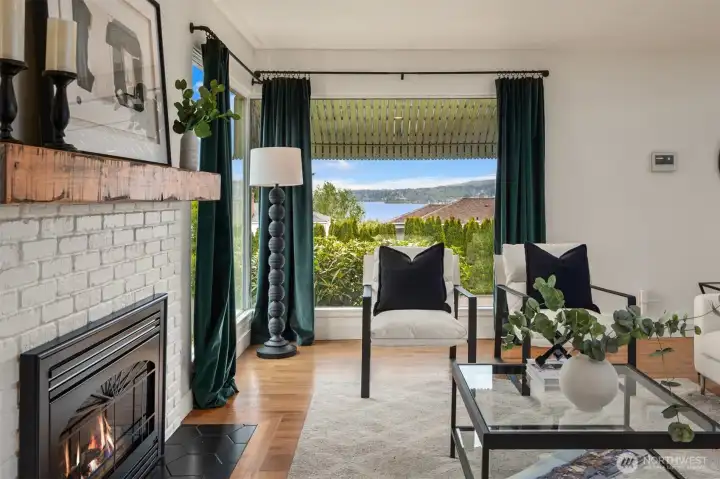 Southeast-facing water views provide a stunning backdrop to the spacious main-floor living room, where natural light and serene surroundings create an inviting place to relax.