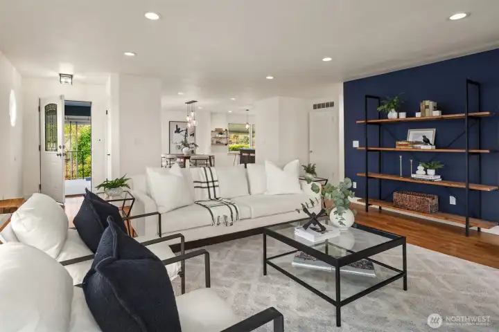 The expansive open-concept living, dining, and kitchen spaces flow seamlessly together, creating an ideal setting for effortless entertaining and everyday living.