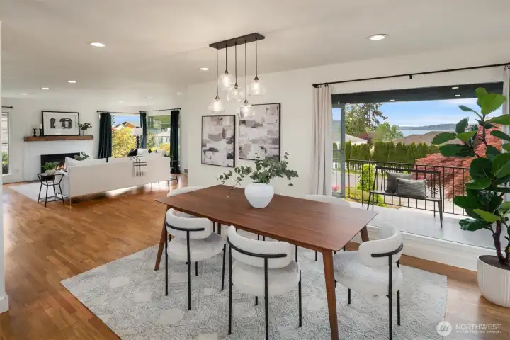 The spacious dining room is perfectly positioned to capture sweeping views of Lake Washington, stretching south toward Seward Park and Mercer Island.