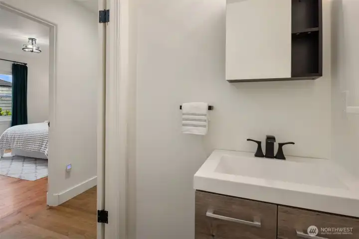 Conveniently located on the main floor, the powder room offers both style and functionality for everyday living and effortless entertaining.