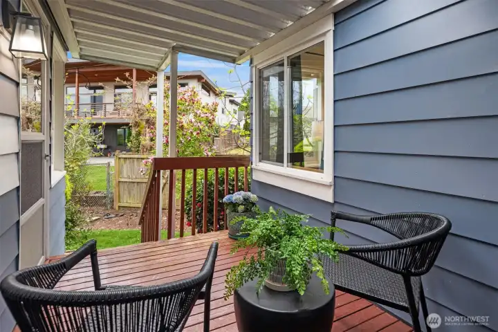 Just beyond the kitchen, the private patio offers a peaceful outdoor retreat for morning coffee, alfresco dining, or relaxing beneath the Northwest sky.