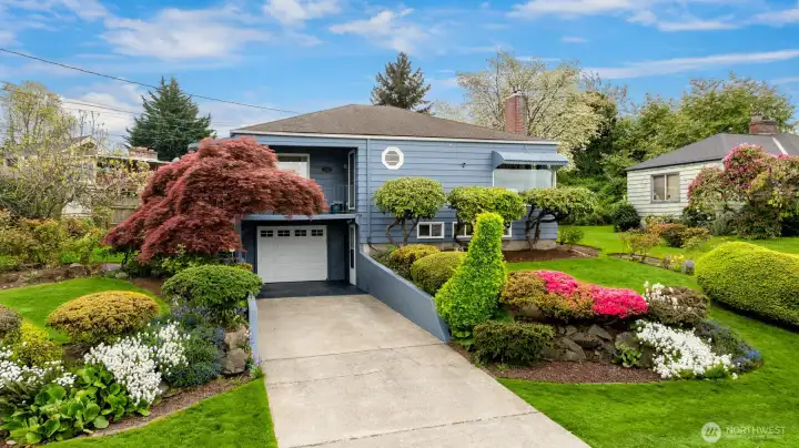 In addition to the attached one-car garage, the home offers generous driveway parking and convenient on-street parking for guests.