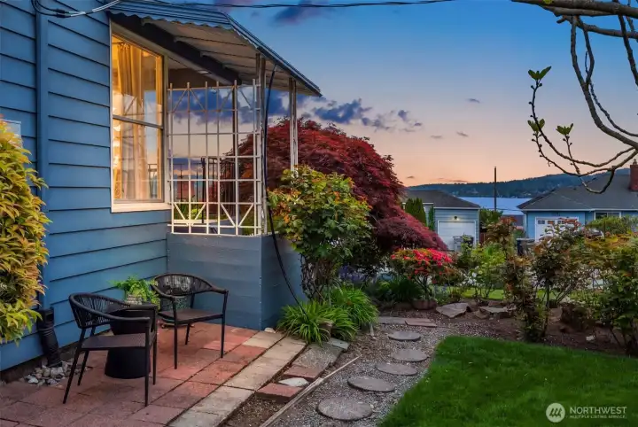 Gorgeous views from the side yard looking toward Lake Washington. Perfect for a nice summer evening barbecue or a fun game night with yard games.