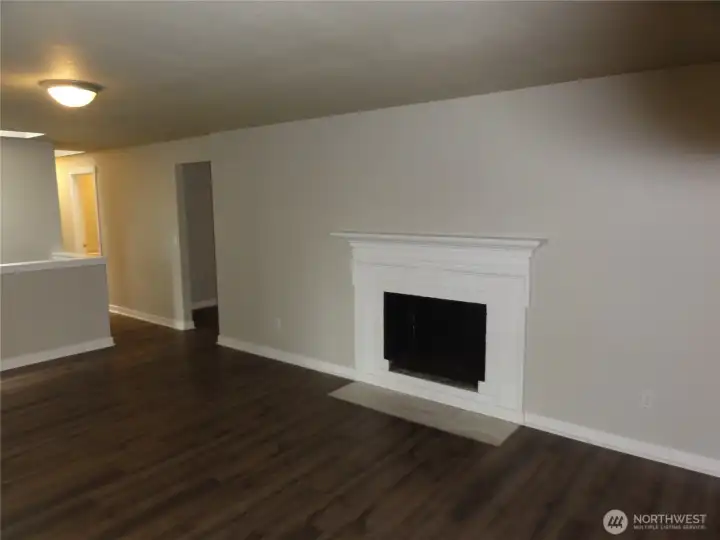 Living room with wood fireplace. Living room with wood fireplace.