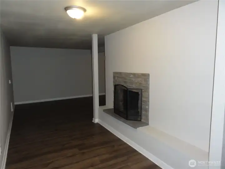 Family room in the lower level with fireplace. Family room in the lower level with fireplace.