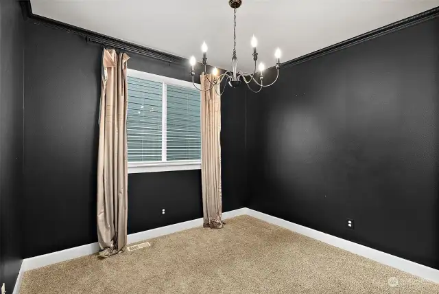 One of two main floor bedrooms. Don't you love the black paint! So chic!