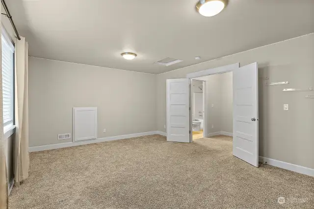 Double doors in this bonus room. Make this a large bedroom space, a bonus movie room, office and workout area. Many possibilities.