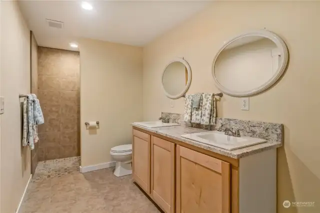 This is your Primary Bathroom and to the right of the sink is a large area. plumbed for a tub (if you want another one)
