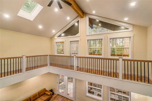 The beautiful pitched ceiling and the beautiful support beam, this house has tons of natural light, so open and happy!