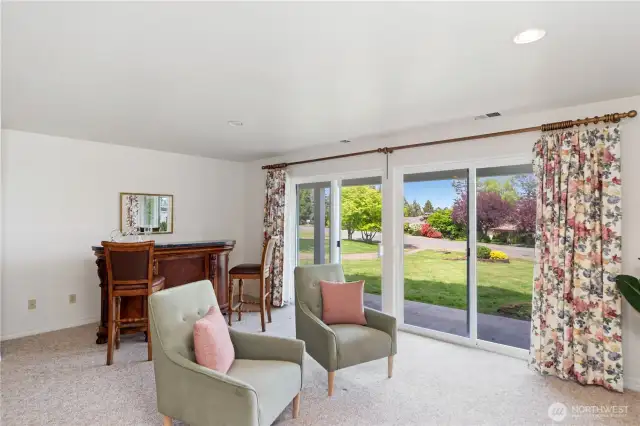 The bar and bar chairs shown in this photo stay with the house!