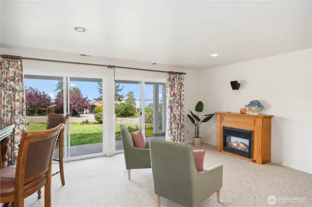 Wouldn't it be fun to entertain in this space with the bar and electric fireplace?