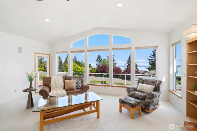 Your living room has access to the large deck that extends the length of the front of the home. There is also access from Primary En-Suite.