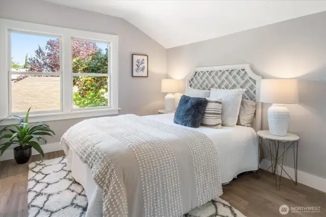 Primary bedroom offers calm and ease with an ensuite bath, walk-in, and discreet storage.