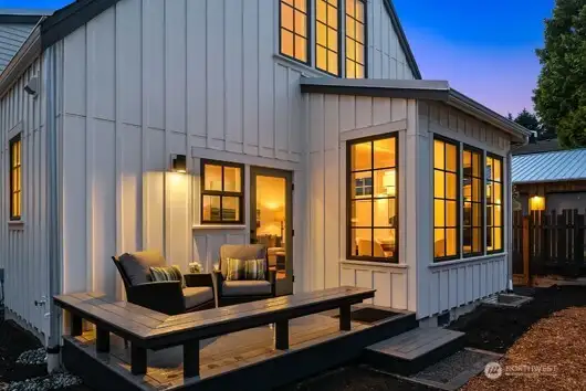 A cozy rear deck with bench seating is just off the kitchen and dining room and overlooks the fenced rear yard, just right for your pup and BBQ.