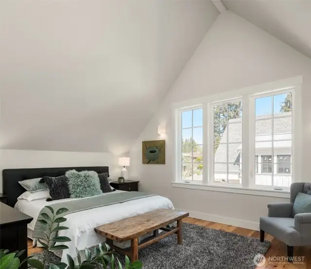 The second of two large upstairs bedrooms accomodates a king size bed and is filled with light from lovely multipaned windows.