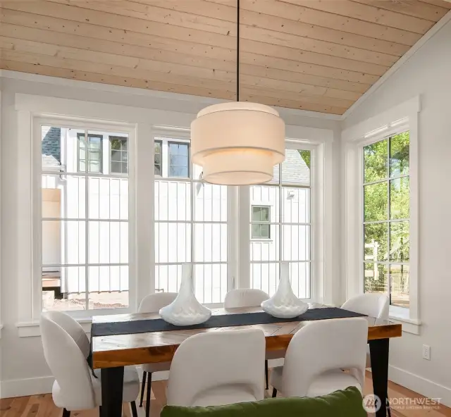 Dining space is roomy and comfortably accommodates a large family dinner.