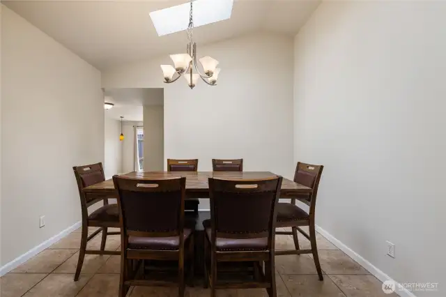 Formal Dining Room with vaulted ceilings and natural light