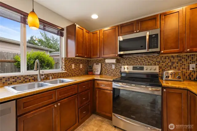 Newer Stainless Steel appliances in kitchen
