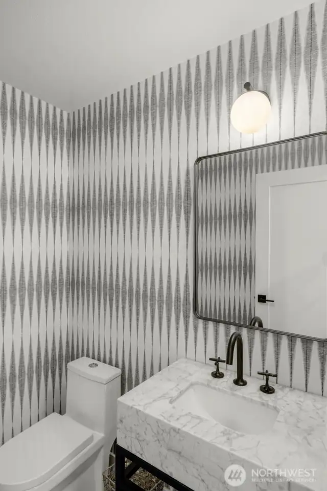 Luxe guest powder rm: marble vanity, pocelain floors, designer wallpaper