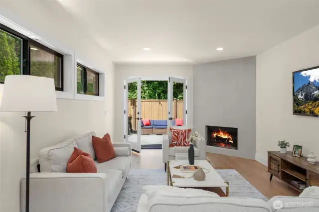 Sunken living room was by design. Cleverly crafted and gives depth to the space.