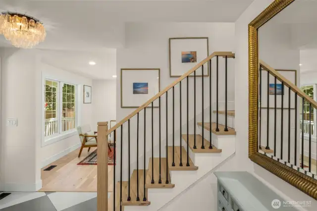 Expererience an inviting foyer w/ porcelain floors and Restoration Hardware Chandelier